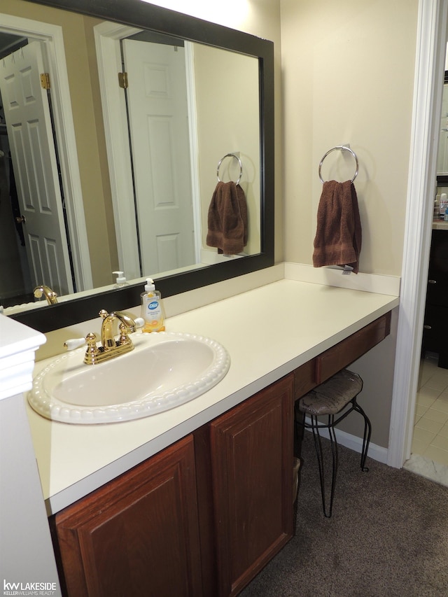 bathroom featuring tile patterned floors and vanity