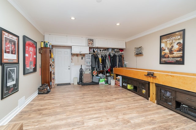 interior space featuring visible vents, baseboards, light wood-type flooring, ornamental molding, and recessed lighting