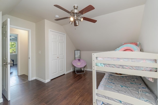 bedroom featuring baseboards, a ceiling fan, lofted ceiling, and wood finished floors