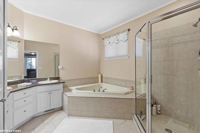 ensuite bathroom with a bath, tile patterned flooring, a stall shower, and vanity