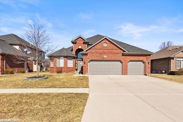 view of front of property featuring brick siding, an attached garage, and a front lawn