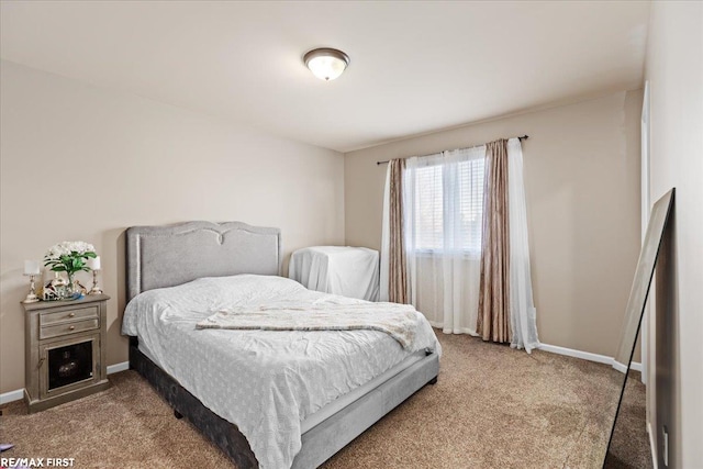 bedroom with baseboards and carpet flooring