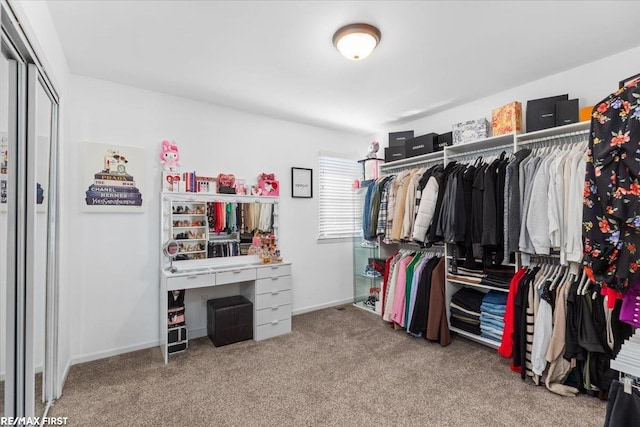 walk in closet featuring carpet