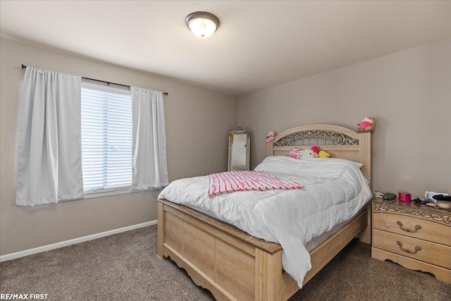 bedroom with baseboards and carpet floors