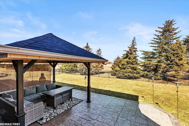 view of patio featuring a gazebo, a fenced backyard, and an outdoor hangout area