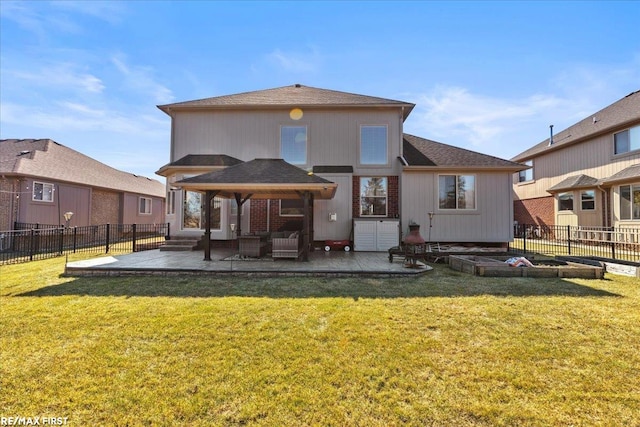 back of property featuring a patio, a lawn, and a fenced backyard