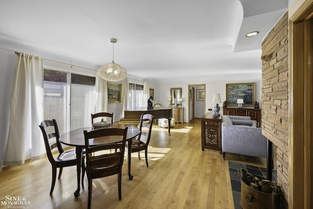 dining space featuring light wood-style floors