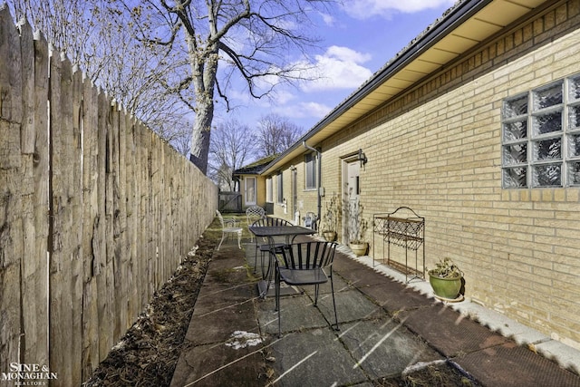 view of patio featuring fence