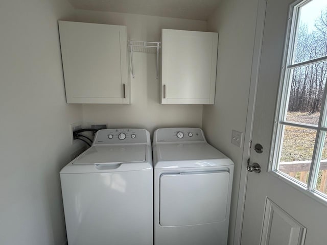 laundry area featuring cabinet space and independent washer and dryer