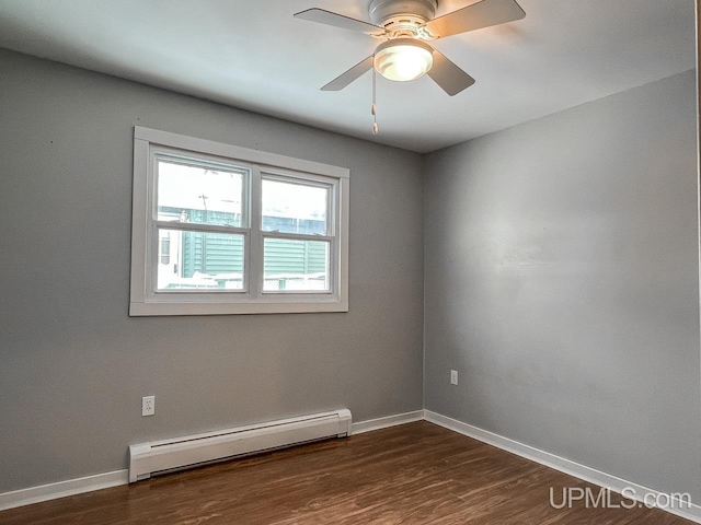 unfurnished room with dark wood-style flooring, baseboards, baseboard heating, and ceiling fan