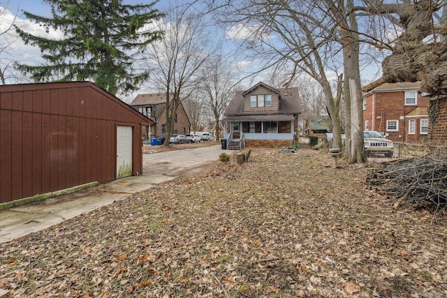 view of yard with an outbuilding and a sunroom