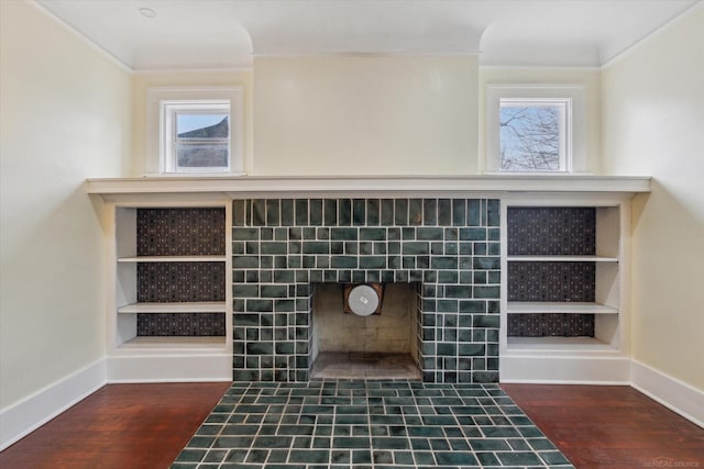 details featuring baseboards, wood finished floors, and ornamental molding