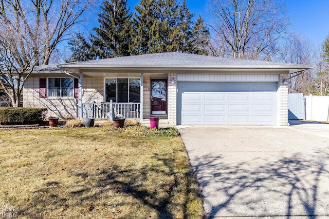 ranch-style house with driveway, covered porch, a front yard, an attached garage, and brick siding