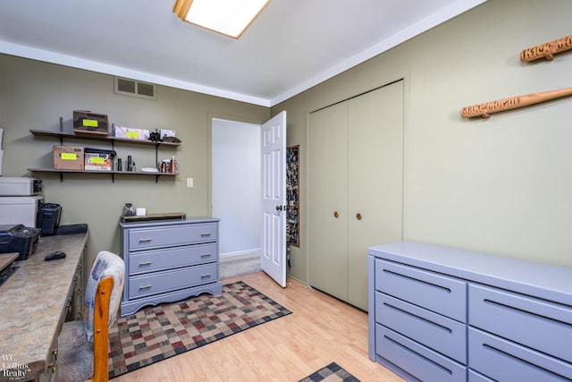 office space with visible vents and light wood-style flooring