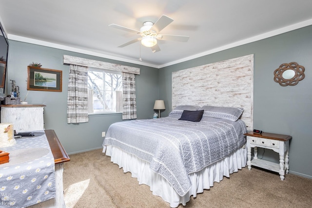 carpeted bedroom with a ceiling fan and baseboards