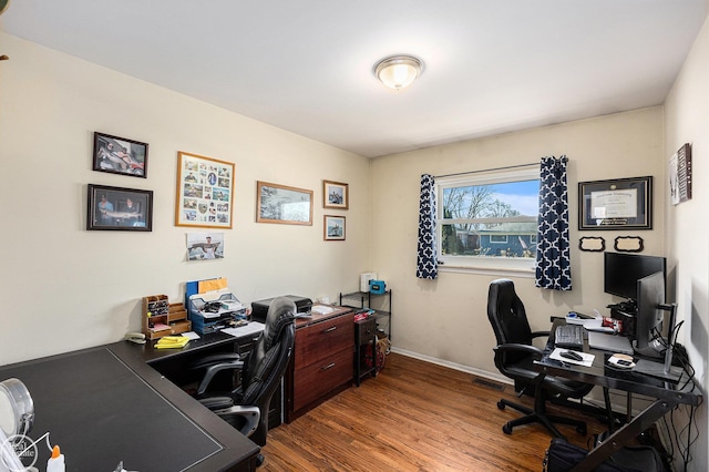 office area with baseboards and wood finished floors