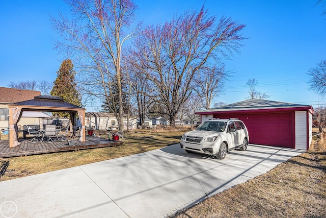 view of yard featuring a gazebo and an outbuilding