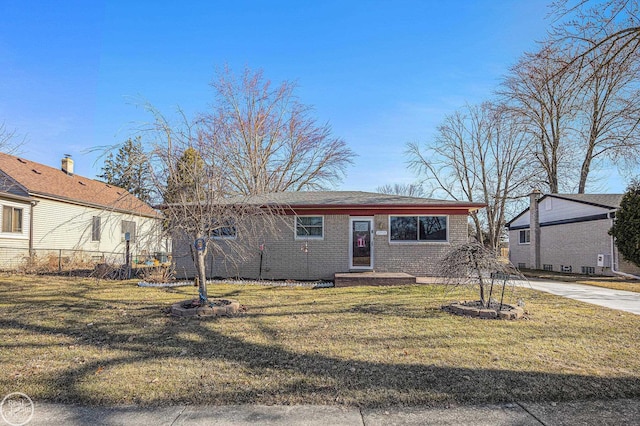 view of front of house featuring brick siding, concrete driveway, a front yard, and fence