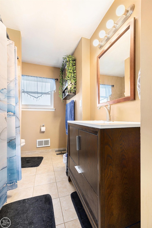 full bath with visible vents, baseboards, toilet, tile patterned floors, and vanity