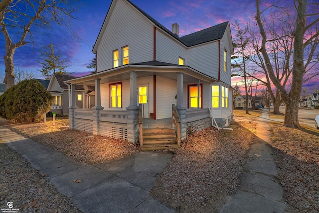 view of front of property featuring covered porch