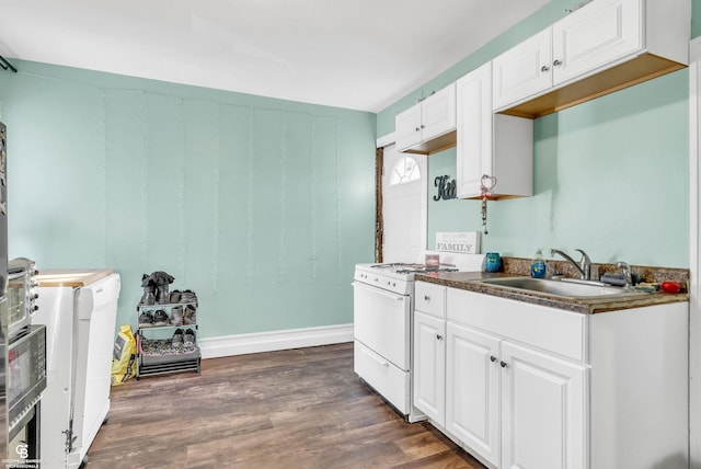 kitchen with white electric stove, white cabinetry, dark wood-type flooring, and a sink