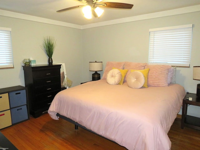 bedroom featuring crown molding, ceiling fan, and wood finished floors