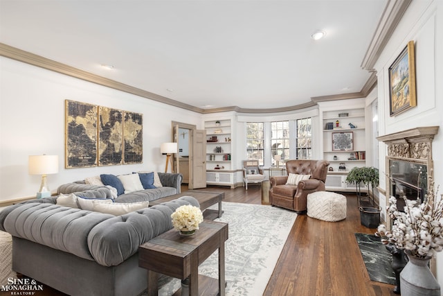 living room with built in features, a premium fireplace, ornamental molding, and dark wood-style flooring