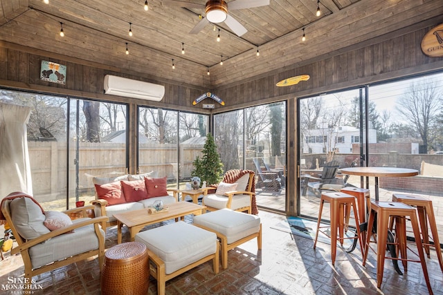 sunroom with lofted ceiling, ceiling fan, an AC wall unit, rail lighting, and wooden ceiling