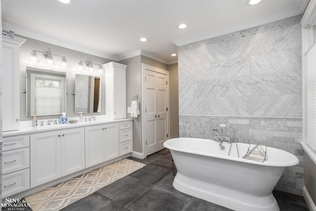 bathroom with a soaking tub, double vanity, recessed lighting, ornamental molding, and tile walls