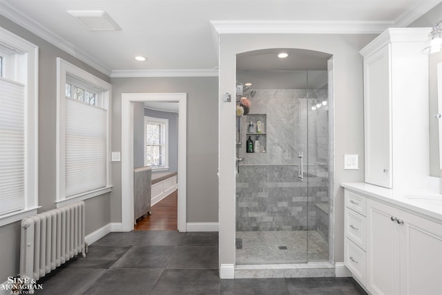 full bath with crown molding, radiator heating unit, and a stall shower