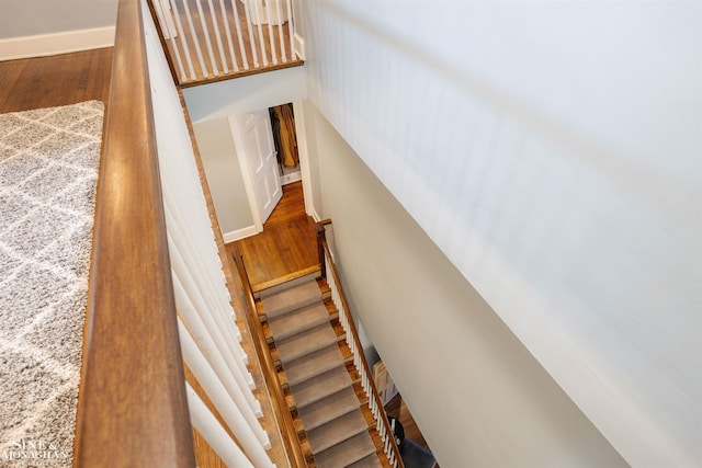 stairway with wood finished floors