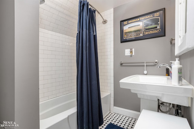 full bathroom with baseboards and shower / bath combo