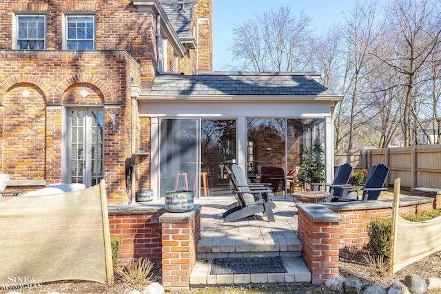 view of patio / terrace with fence and french doors