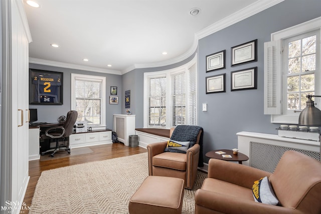 office featuring radiator, crown molding, baseboards, recessed lighting, and wood finished floors