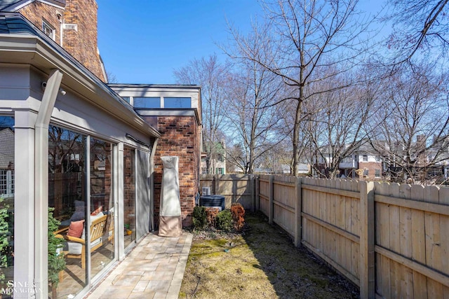 view of yard featuring central air condition unit and fence private yard