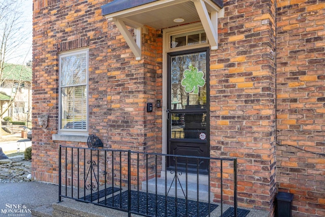 entrance to property with brick siding