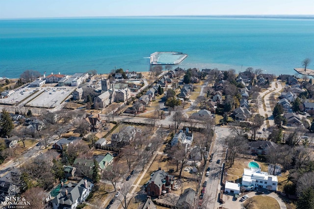 birds eye view of property with a residential view and a water view