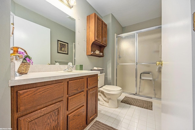 bathroom featuring visible vents, a shower stall, toilet, and vanity