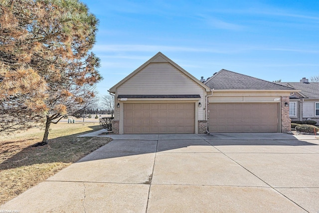 view of front of home featuring brick siding, driveway, and a shingled roof