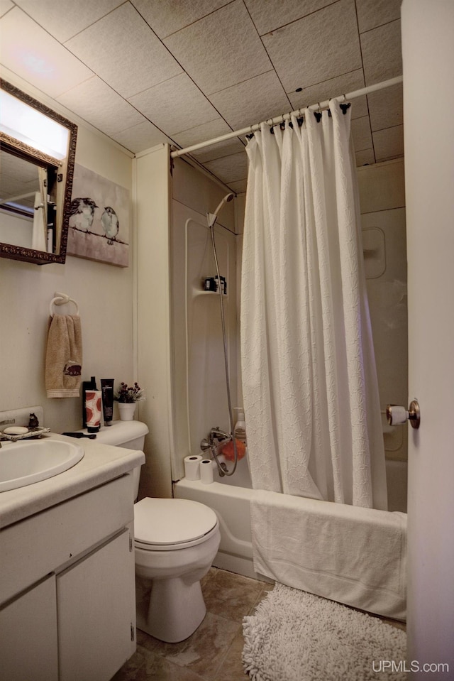 bathroom with toilet, vanity, and shower / tub combo with curtain