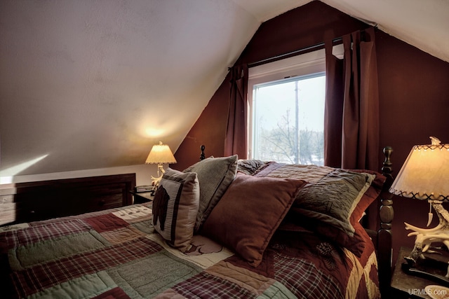 bedroom featuring lofted ceiling