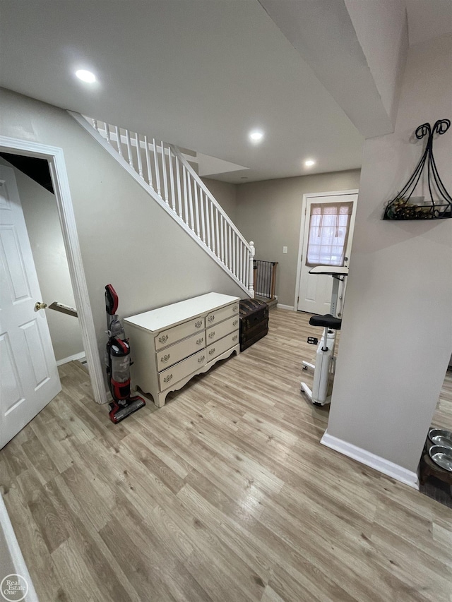 interior space with recessed lighting, baseboards, and wood finished floors