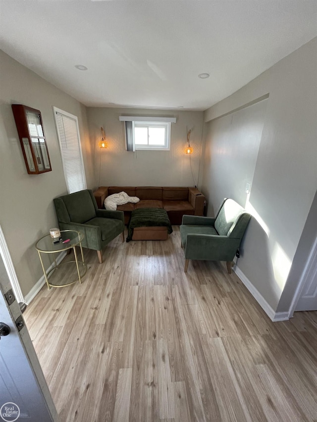 living room featuring baseboards and wood finished floors