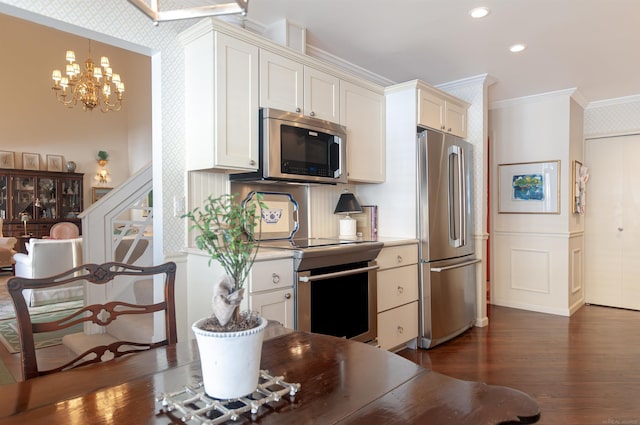 kitchen with dark wood finished floors, recessed lighting, stainless steel appliances, white cabinets, and crown molding