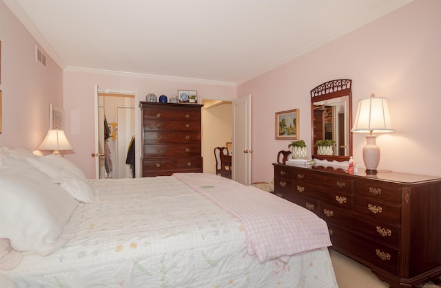 bedroom featuring visible vents and crown molding