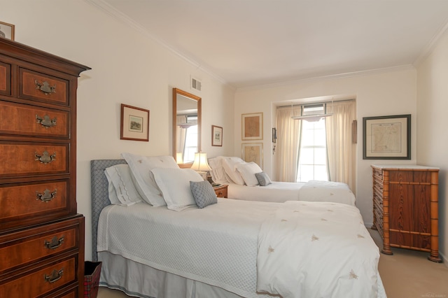 bedroom featuring visible vents, light carpet, and crown molding