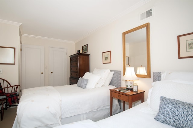 bedroom with visible vents and crown molding