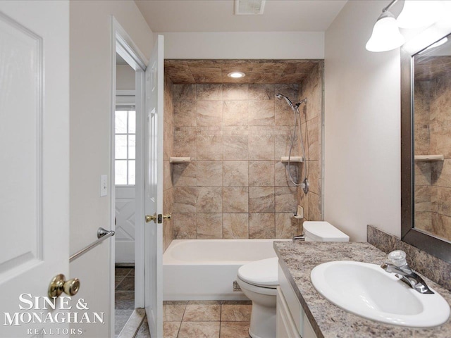 full bath featuring vanity, visible vents, tile patterned flooring, bathing tub / shower combination, and toilet