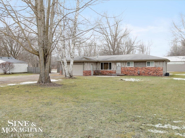 view of front of home with driveway, a front yard, a garage, and fence