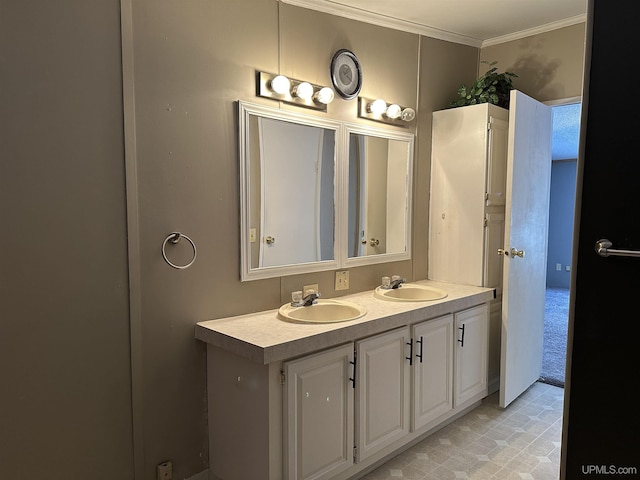 full bathroom with double vanity, ornamental molding, and a sink